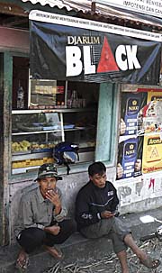 'Javanese Men, hanging out in front of a Street Restaurant' by Asienreisender
